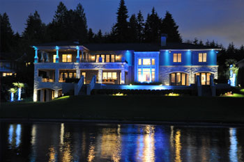 back exterior at night of Mercer Island Residence using Pulsar ChromaBump MR16 LED architectural lighting