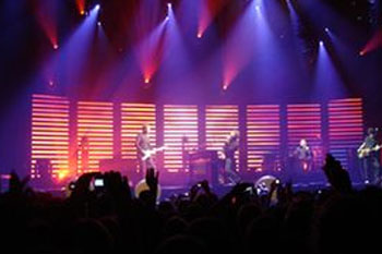 stage using 46 SGM Giotto 400 Spot CMY moving head lights during band Coldplay's Twisted Logic World Tour, United Kingdom