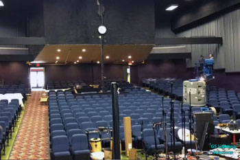 lighting equipment and person checking lights in the back inside Calvary Baptist at the Liberty - Ellensburg, WA