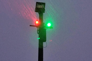 vibrant colors of red and green from LED fixutres mounted on pole at Lunar Lights Tubing Peek 'n Peak Resort - Clymer, New York U.S.A.