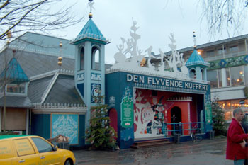 fanciful aqua castle facade with accents of gold and white entrance to dark ride The Flying Trunk Dark Ride, Tivoli Gardens - Copenhagen, Denmark