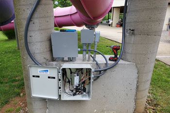 opened gray junction box under the Waloopas Water Slides - Venture River Water, Eddyville, Kentucky, USA